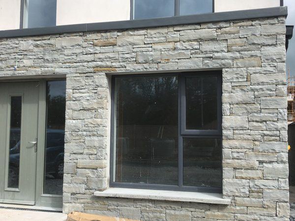 Liscannor stone facade with window and door reveals, Barters Wood