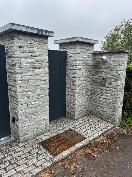 Natural stone entrance pillars with granite caps, Cork