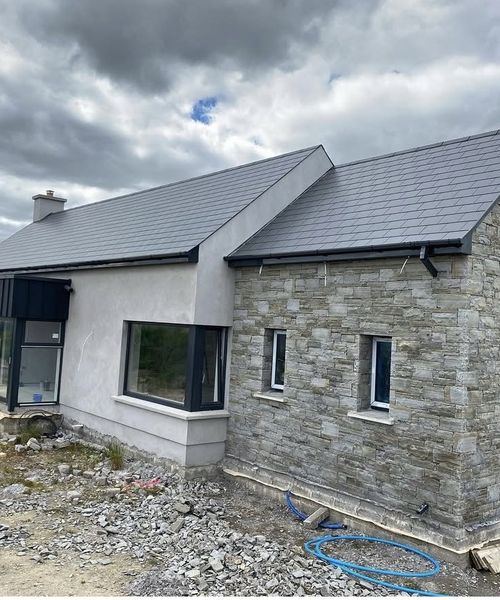 Natural stone house with stone chimney detail, Co. Cork