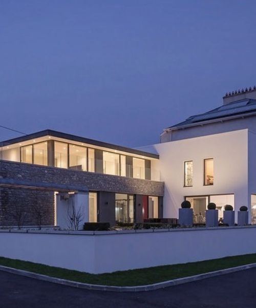Natural stone house facade with granite quoins, Co. Cork