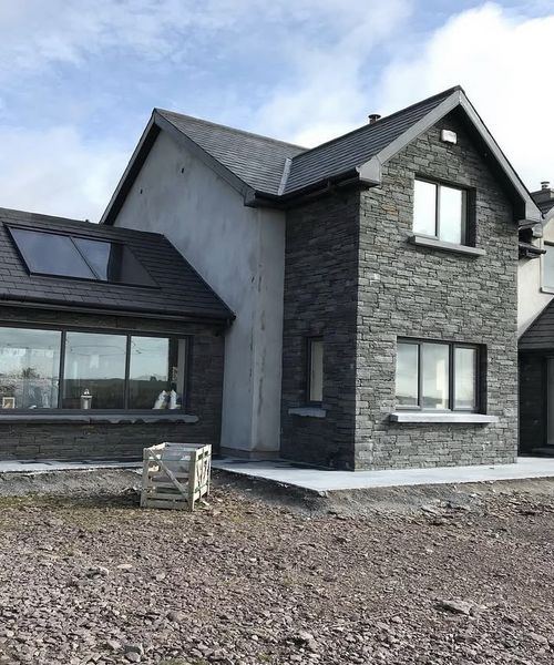 Rustic stone house facade in Irish limestone, Co. Cork