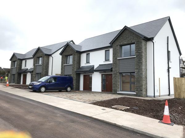 Terrace of new homes with natural stone gable features, The Orchard