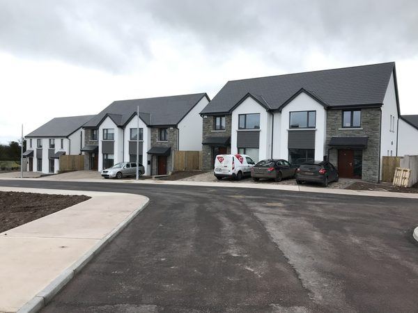 Completed houses with stone facades, The Orchard, Watergrasshill