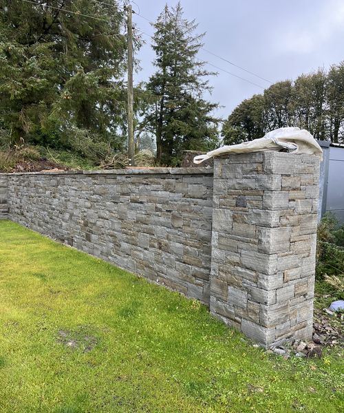 Sawn stone garden wall with matching pillar