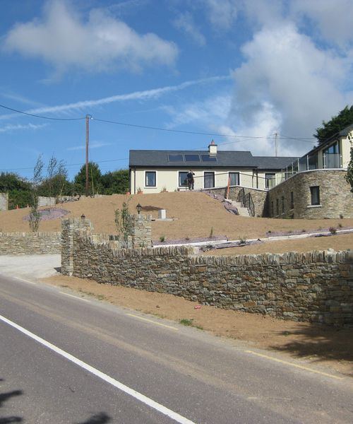 Dry stone boundary walls and entrance on elevated site