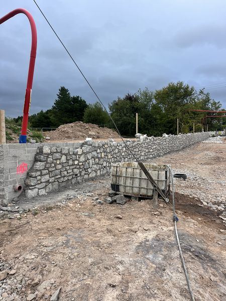 Stone faced retaining wall under construction at Water Rock Road, Midleton
